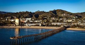 A pier with many people walking on it