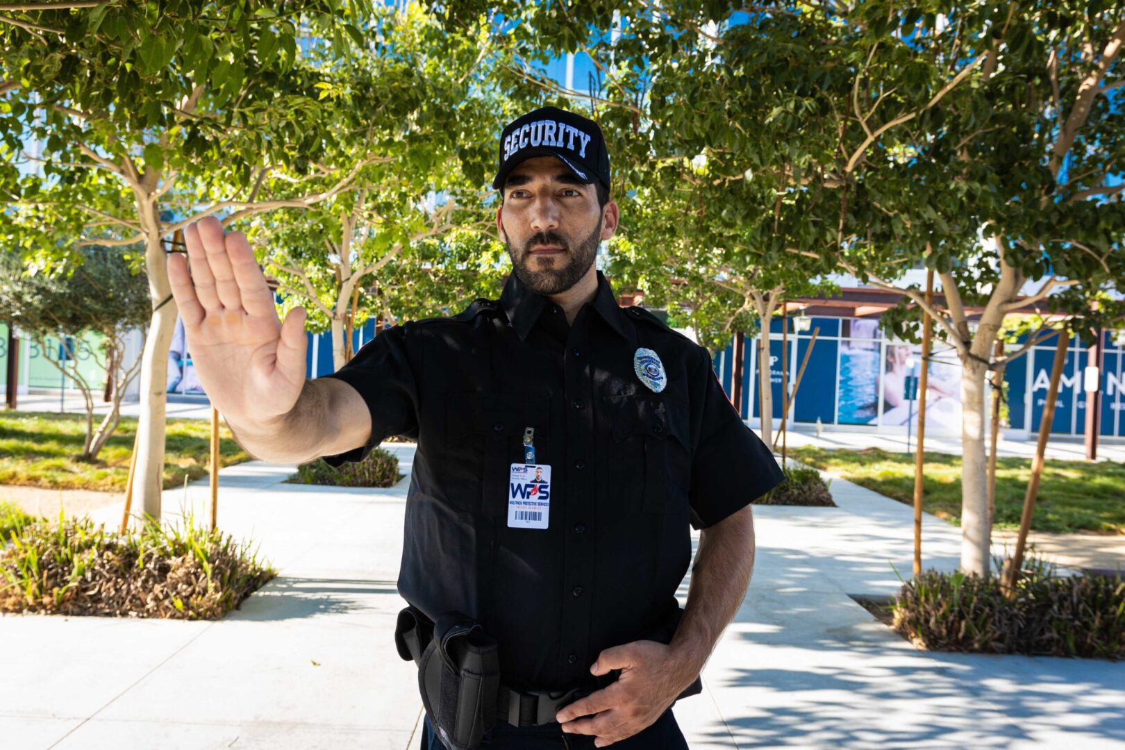 A police officer is waving to the camera.
